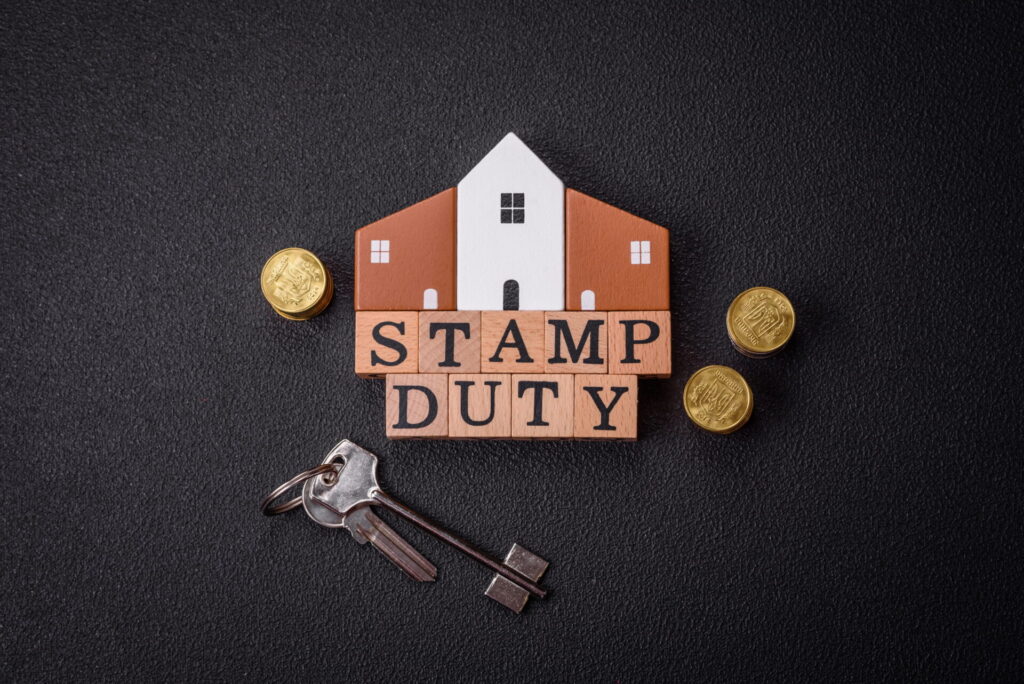 Image showing stamp duty with a key and coins